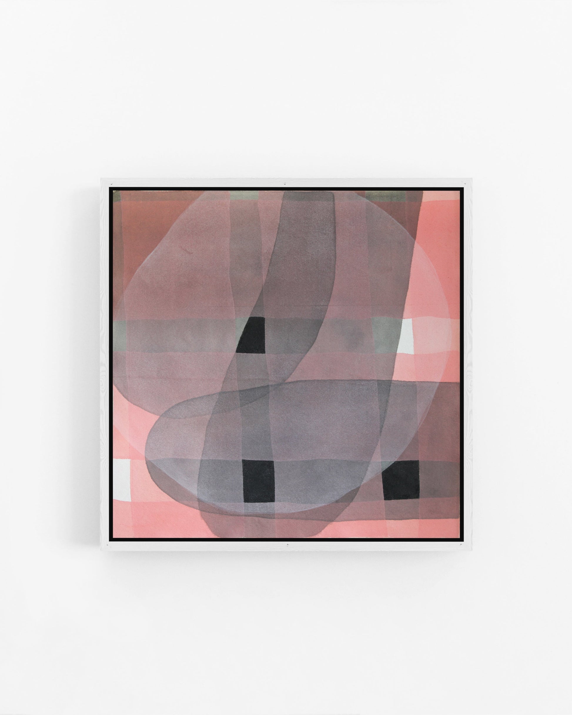 Framed abstract art piece on a white wall