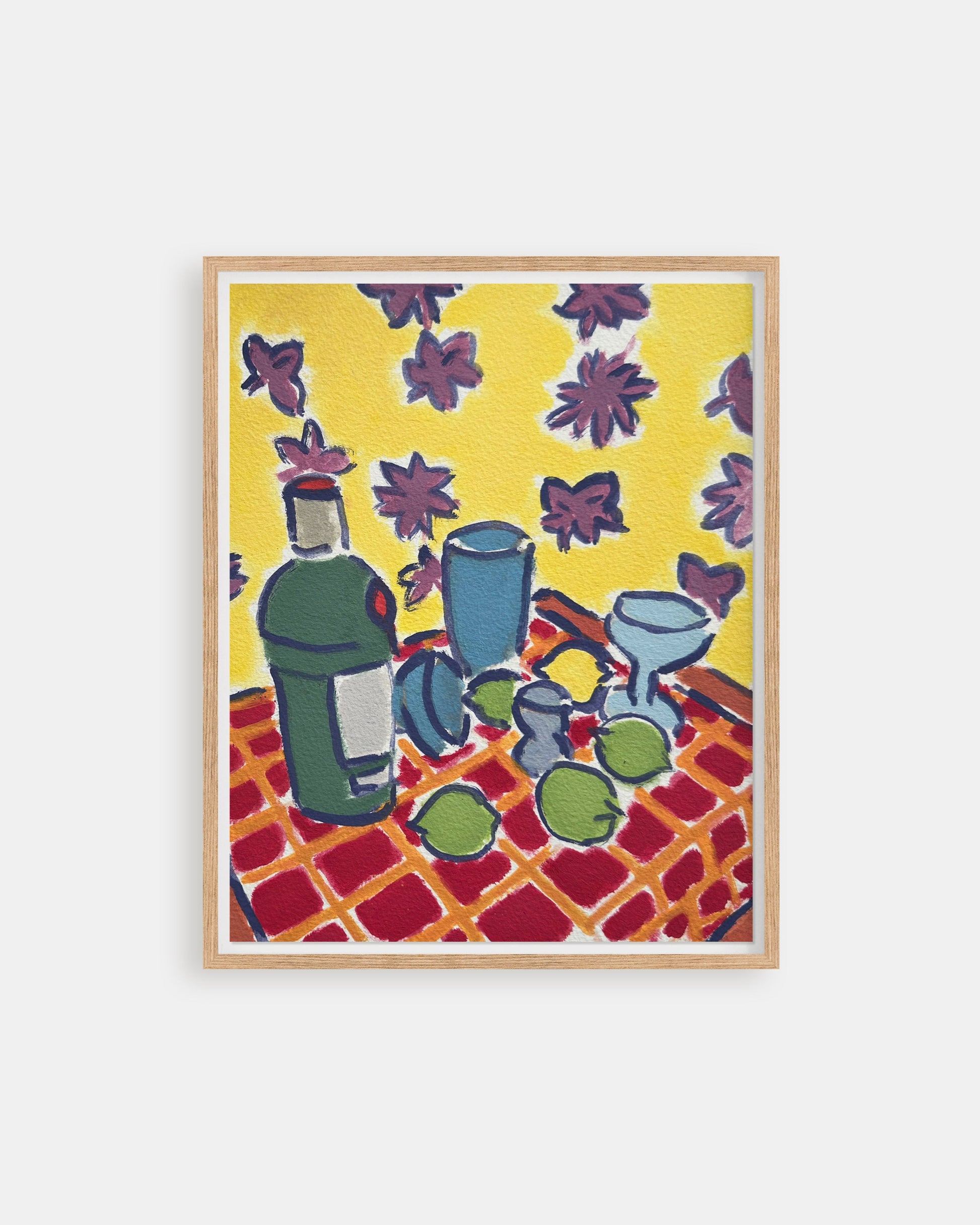 Framed artwork of a still life scene with bottles and fruit on a checkered tablecloth against a yellow background.