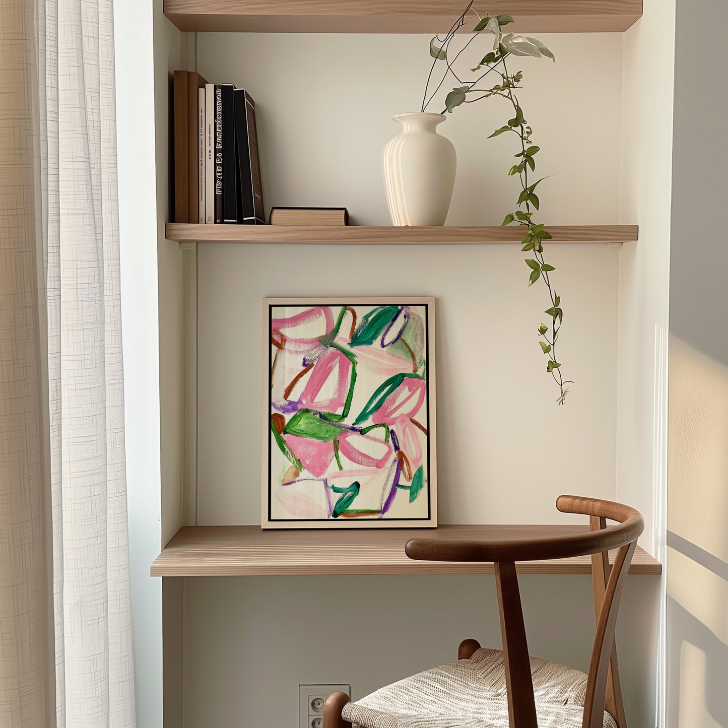 A colorful abstract painting on a desk.