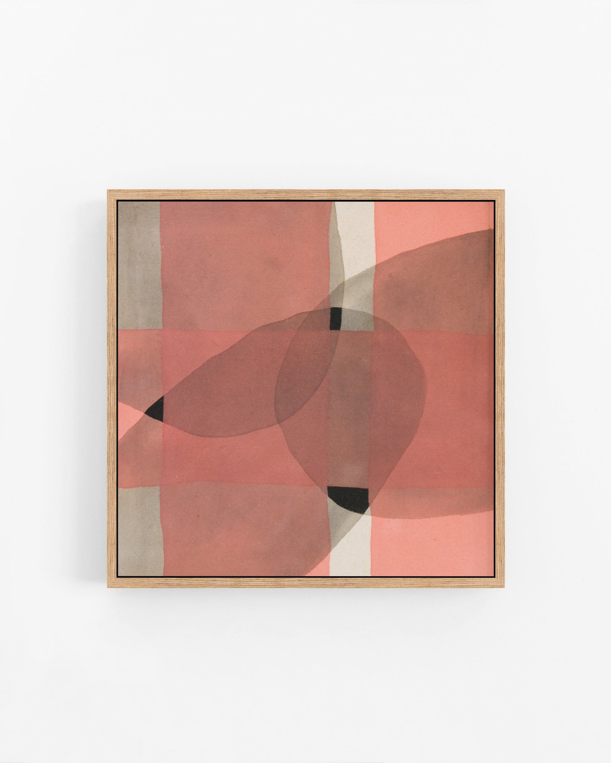 Framed abstract art piece with geometric pink and black shapes.