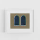 Framed artwork of two arched windows on a beige background