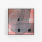 Framed abstract art piece on a white wall