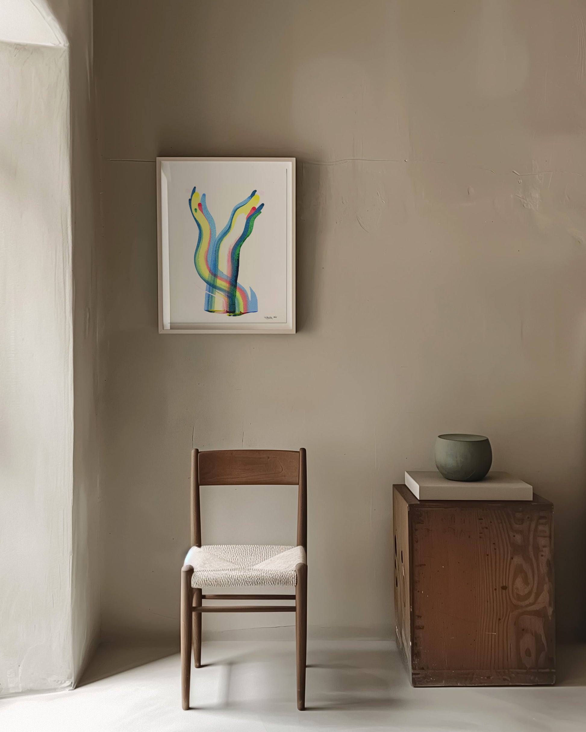 Minimalist interior with a chair, small table, and abstract painting.