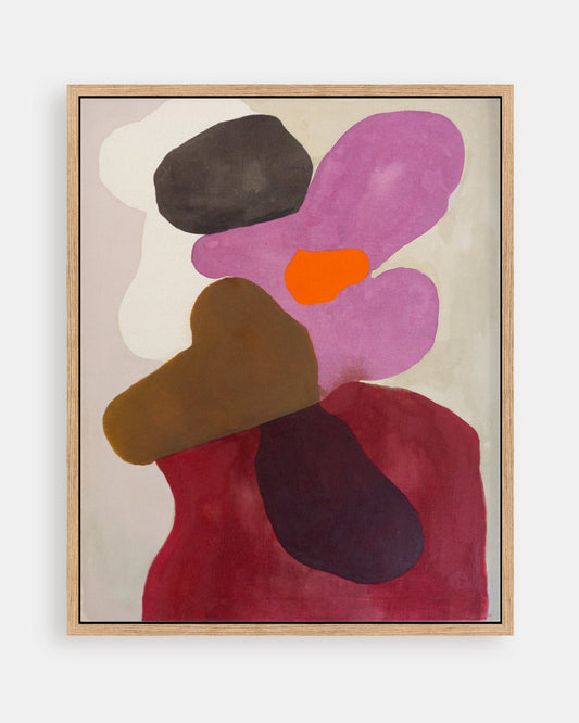 Framed abstract art piece with colorful shapes.