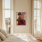 Modern bedroom with abstract painting on wall between two windows.
