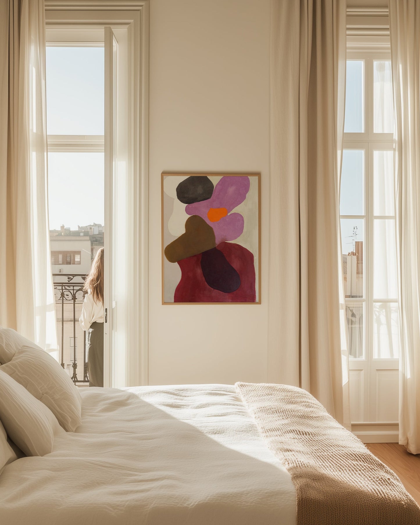 Modern bedroom with abstract painting on wall between two windows.