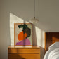 Abstract art on wooden nightstand in a bedroom.