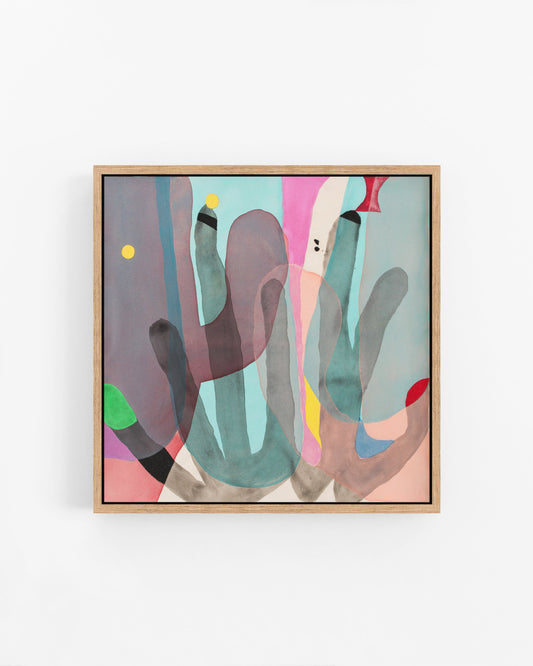 Abstract artwork with colorful shapes in a wooden frame on a white wall.