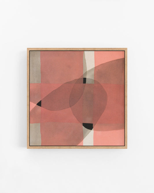 Framed abstract art piece with geometric pink and black shapes.