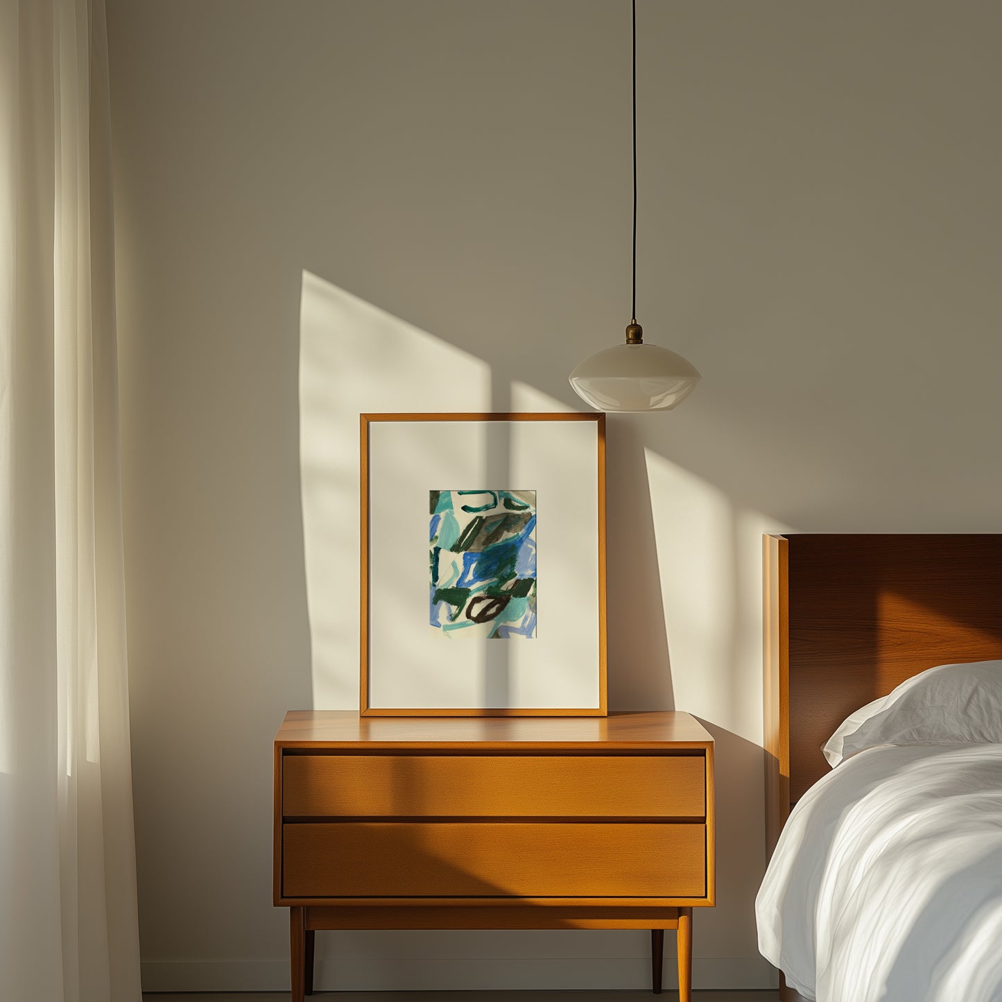 Framed abstract art on wooden nightstand.