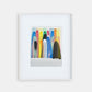 Framed colorful abstract artwork on a white wall