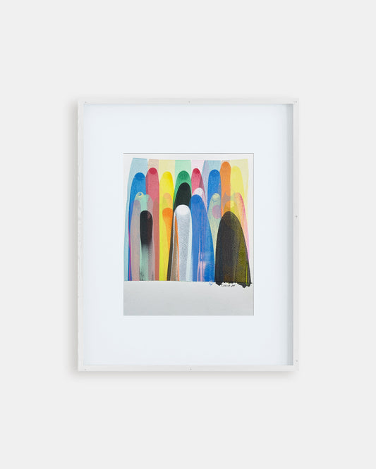 Framed colorful abstract artwork on a white wall