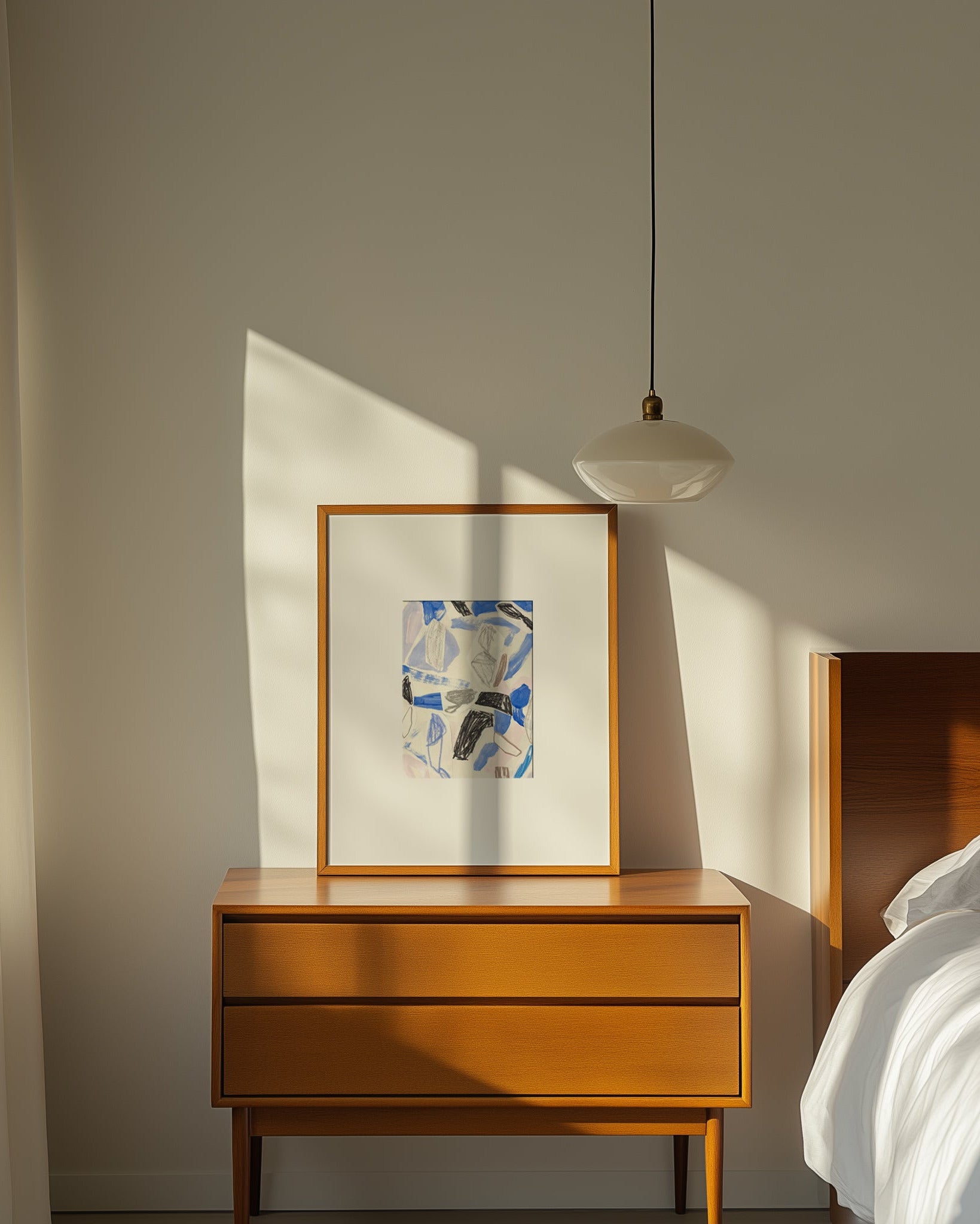 Framed abstract art on wooden beside table