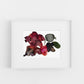 Framed artwork of colorful abstract flowers on a white background