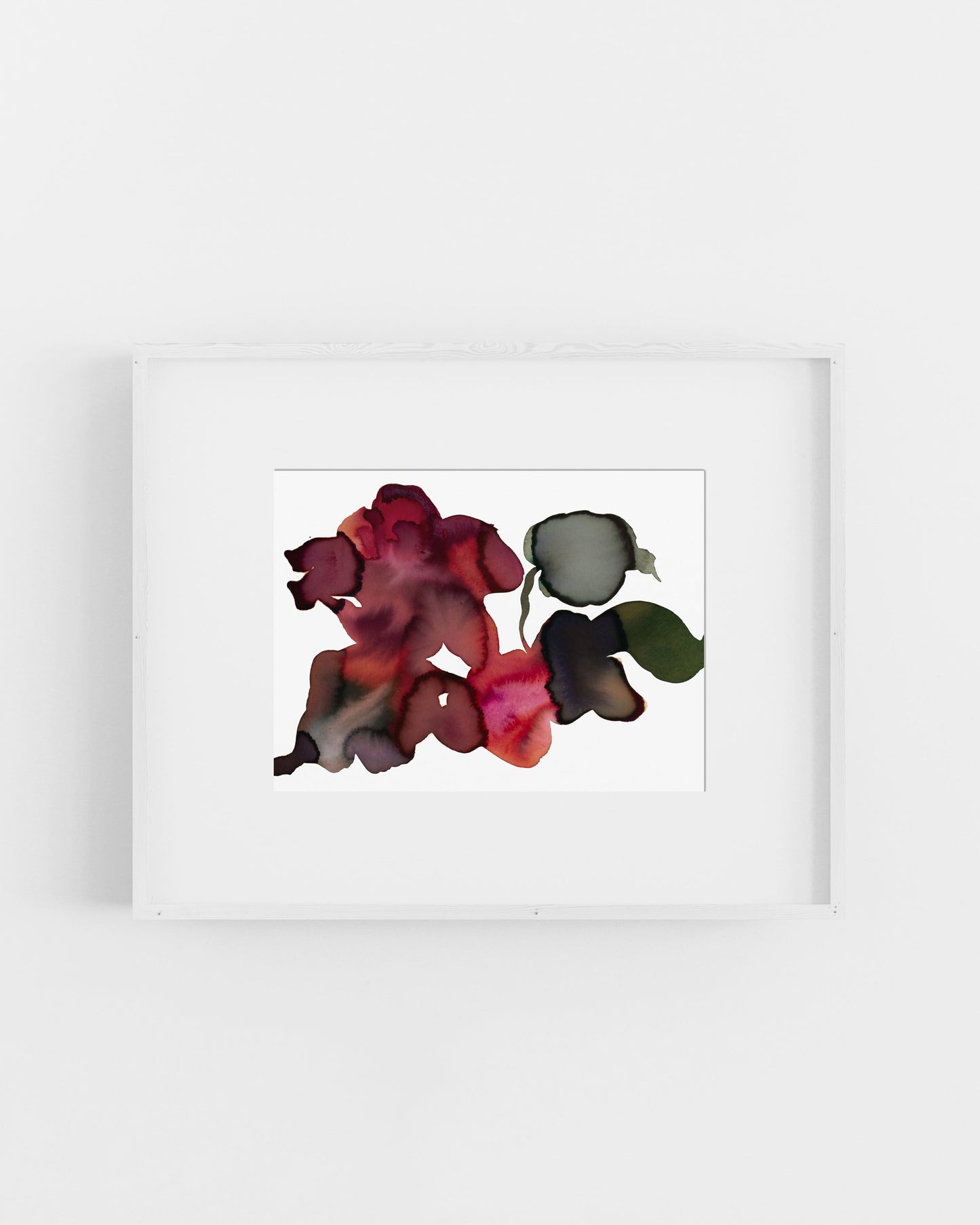 Framed artwork of colorful abstract flowers on a white background