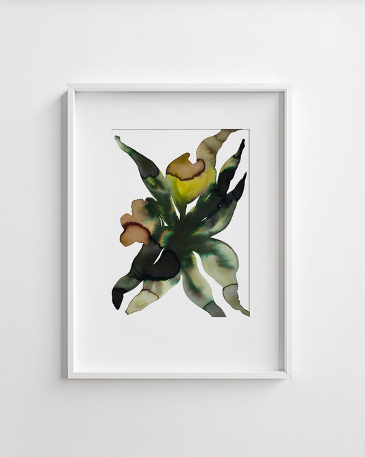 Framed artwork of a abstract flower on a white wall.