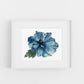 Framed artwork of a blue flower on a white background