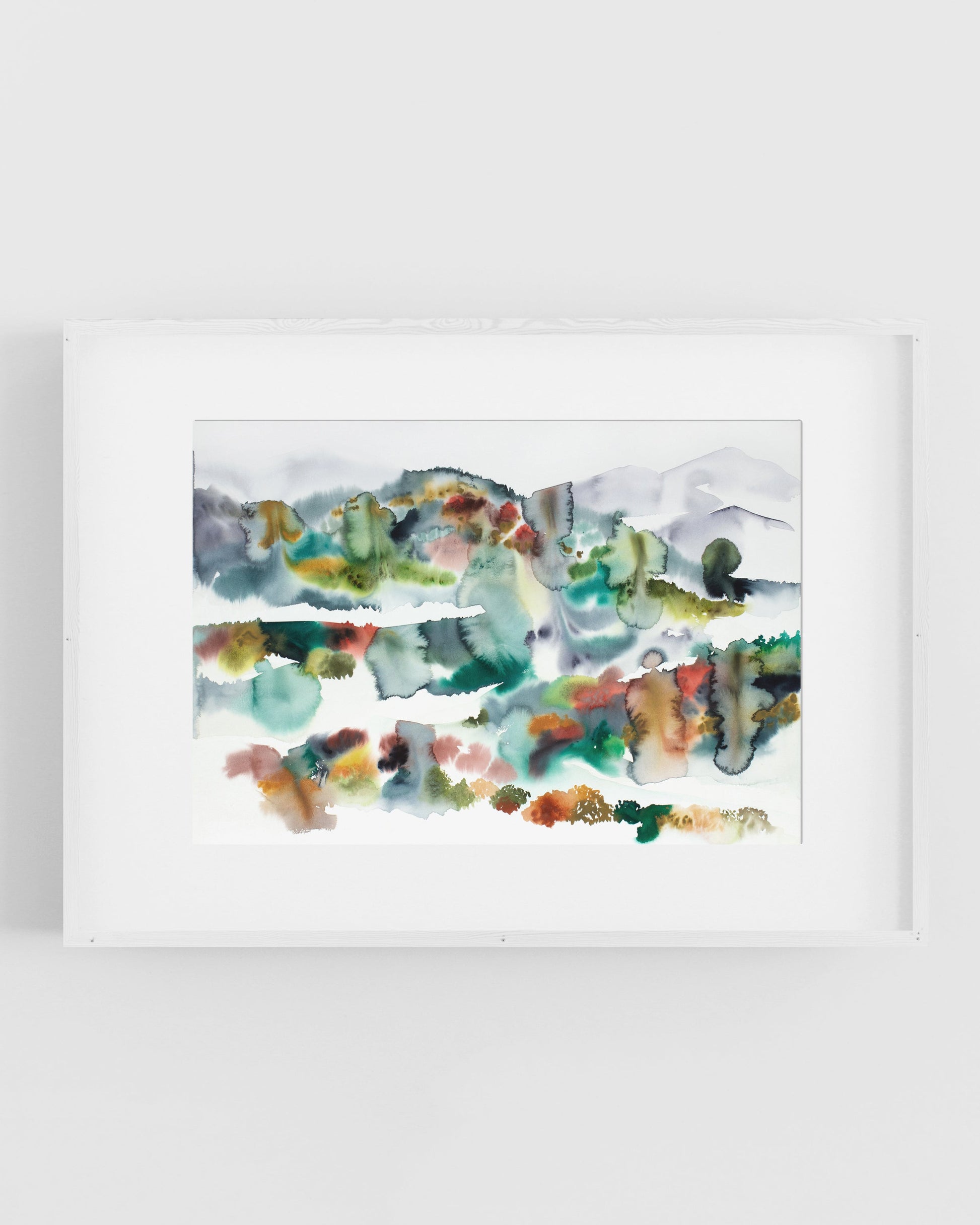 Framed colorful abstract landscape artwork on a white background