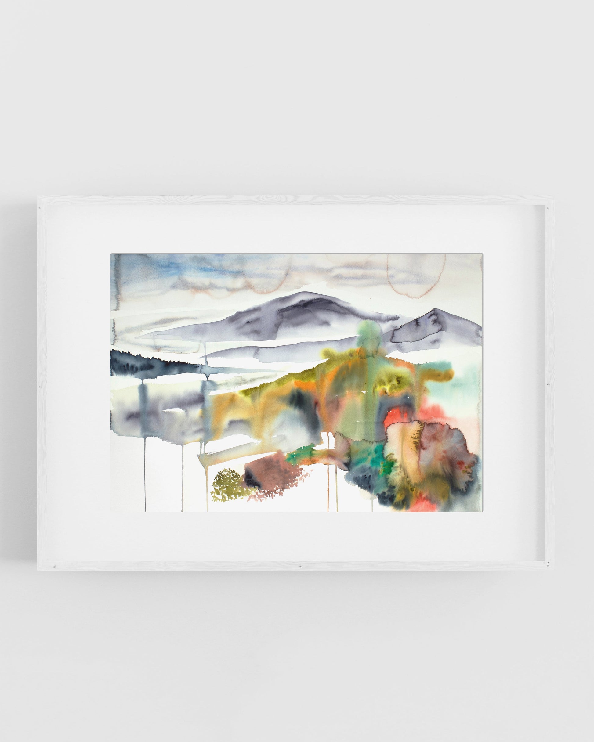 Abstract colorful painting of a landscape on a white wall.