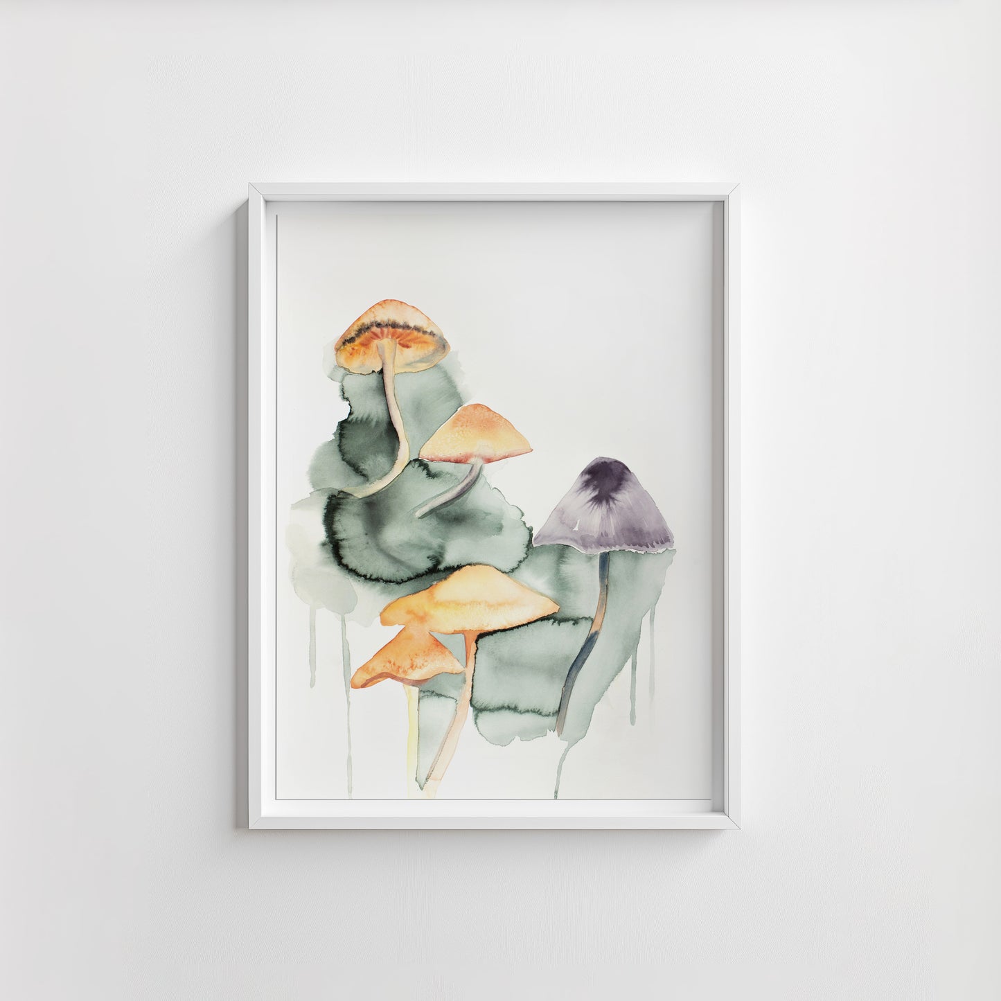 Framed artwork of watercolor mushrooms on a white wall.