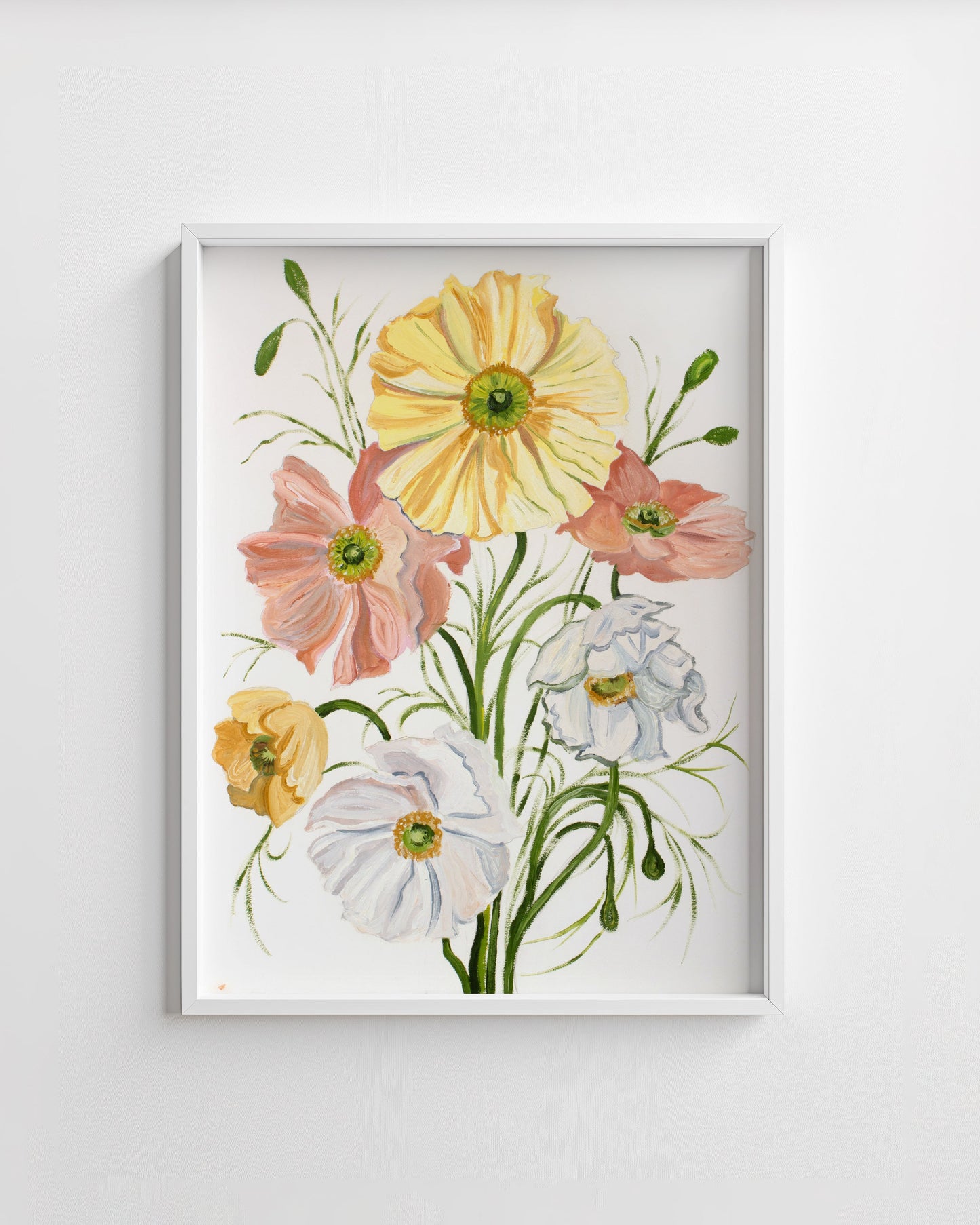 Framed floral artwork with yellow, pink, and white flowers on a white wall.
