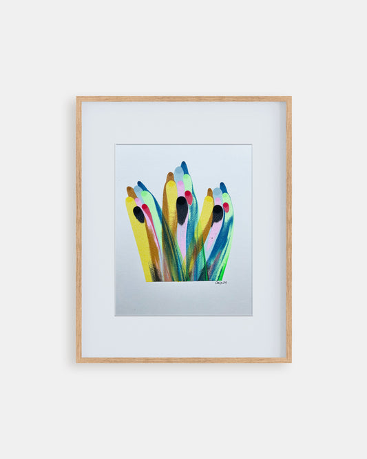 Framed colorful abstract artwork on a white wall
