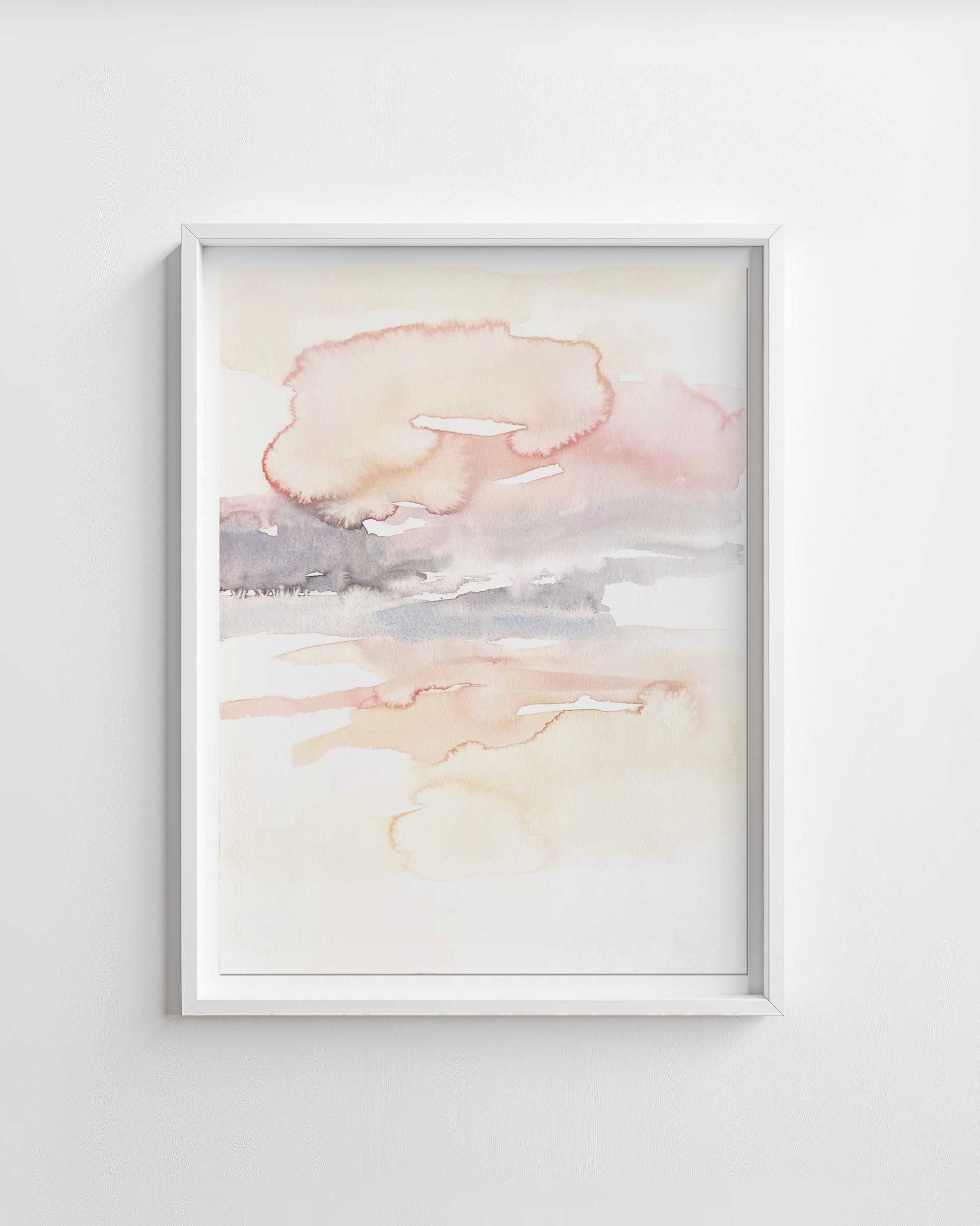 Framed abstract artwork with soft pastel colors on a white wall