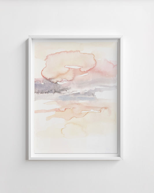 Framed abstract artwork with soft pastel colors on a white wall
